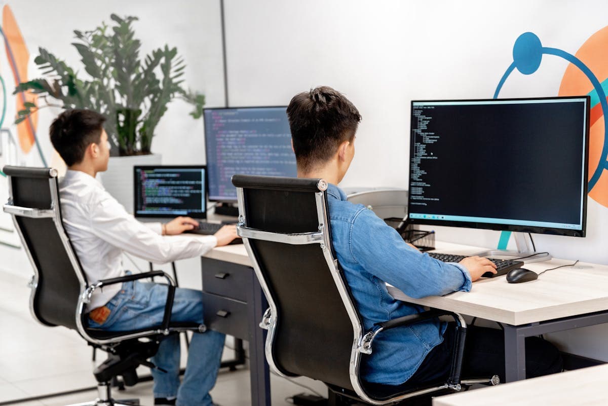 Developers building AI solutions at workstations